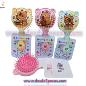 Cepillo infantil redondo con decorativo de dibujos 15 x 8 cm.