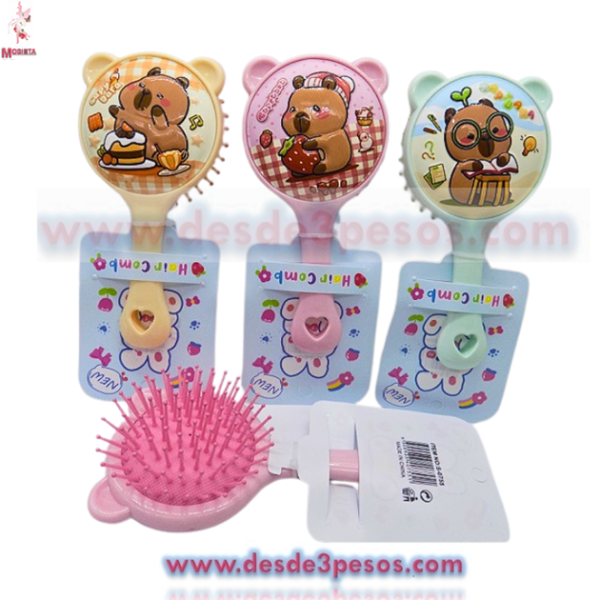 Cepillo infantil redondo con decorativo de dibujos 15 x 8 cm.