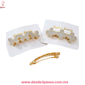 Prendedor de Metal con Figura de Mariposa, Corazon y Flor Cubierto de Pedreria Tornasol 7.5 x 2 cm.